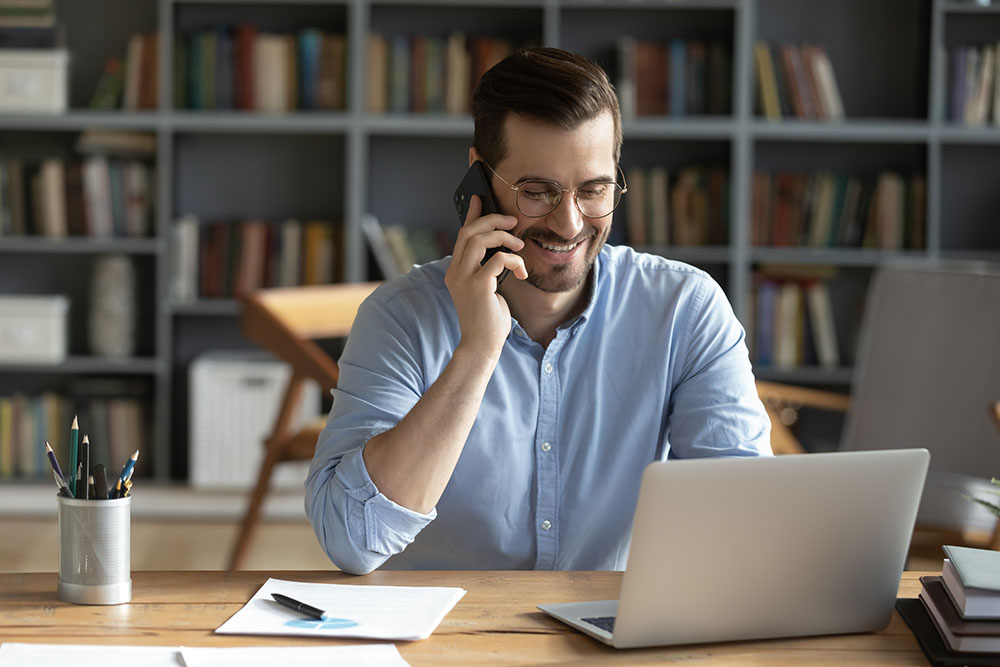 Businessman-using-User-Friendly-Cloud-Phone-System