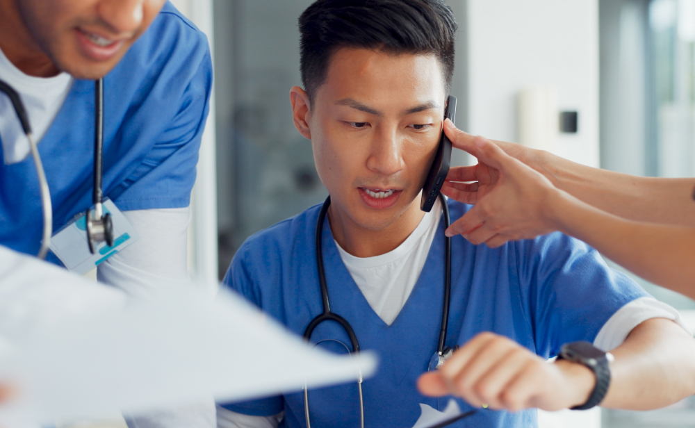 Medical Professional Attending Calls While Working