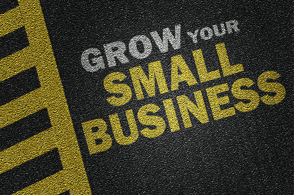 Grow your small business quote printed on road
